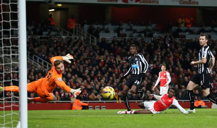 Arsenal s Danny Welbeck sees his shot go just wide Barclays Premier League- Arsenal FC vs Newcastle United - Emirates Stadium - England - 13th December 2014 - EDITORIAL USE ONLY. No use with unauthorised audio, video, data, fixture lists, club league logos or live services. Online in-match use limited to 120 images, no video emulation. No use in betting, games or single club league player publications.