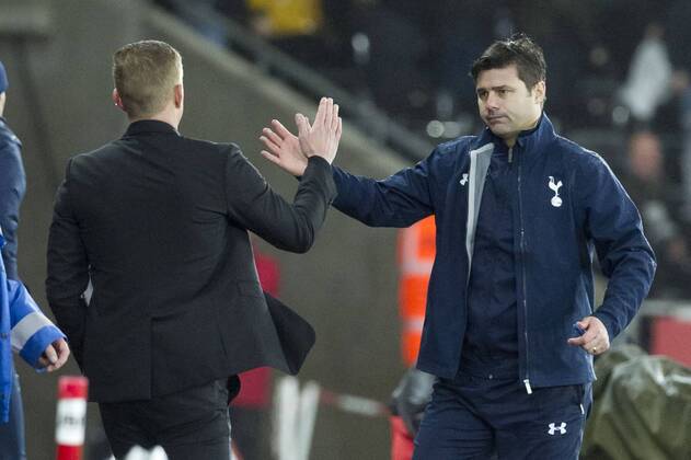 Football - 2014 2015 Premier League - Swansea City vs. Tottenham Hotspur Tottenham Hotspurs manager Mauricio Pochettinoshakes hands with Swansea manager Garry Monk at the end of the game at The Liberty Stadium. COLORSPORT WINSTON BYNORTH