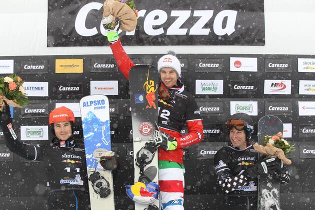 SNOWBOARD - FIS WC Carezza CAREZZA,ITALY,16.DEC.14 - SNOWBOARD - FIS World Cup, parallel giant slalom, men, award ceremony. Image shows Zan Kosir (SLO), Roland Fischnaller (ITA) and Jasey Jay Anderson (CAN). Keywords: trophy.