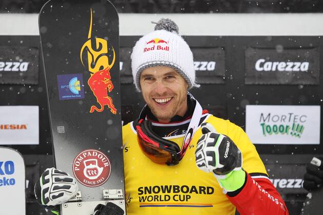 SNOWBOARD - FIS WC Carezza CAREZZA,ITALY,16.DEC.14 - SNOWBOARD - FIS World Cup, parallel giant slalom, men, award ceremony. Image shows the rejoicing of Roland Fischnaller (ITA).