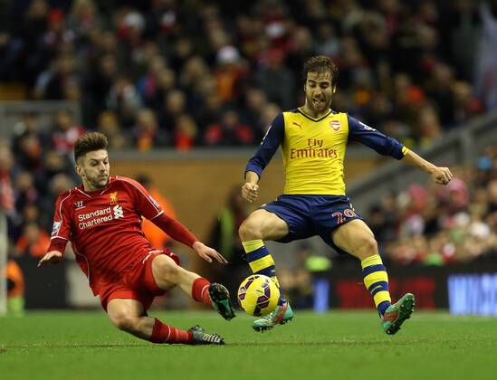 Liverpool s Adam Lallana tussles with Arsenal s Mathieu Flamini Barclays Premier League - Liverpool vs Arsenal - Anfield - England - 21st December 2014 - Picture David Klein Sportimage EDITORIAL USE ONLY. No use with unauthorised audio, video, data, fixture lists, club league logos or live services. Online in-match use limited to 120 images, no video emulation. No use in betting, games or single club league player publications.