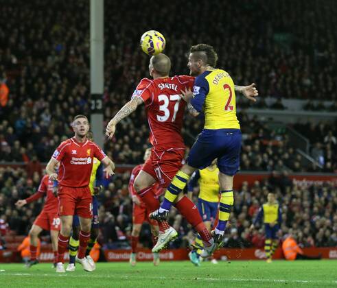 Arsenal s Mathieu Debuchy scoring his sides opening goal Barclays Premier League - Liverpool vs Arsenal - Anfield - England - 21st December 2014 - Picture David Klein Sportimage EDITORIAL USE ONLY. No use with unauthorised audio, video, data, fixture lists, club league logos or live services. Online in-match use limited to 120 images, no video emulation. No use in betting, games or single club league player publications.