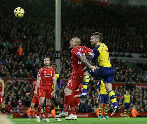 Arsenal s Mathieu Debuchy scoring his sides opening goal Barclays Premier League - Liverpool vs Arsenal - Anfield - England - 21st December 2014 - Picture David Klein Sportimage EDITORIAL USE ONLY. No use with unauthorised audio, video, data, fixture lists, club league logos or live services. Online in-match use limited to 120 images, no video emulation. No use in betting, games or single club league player publications.