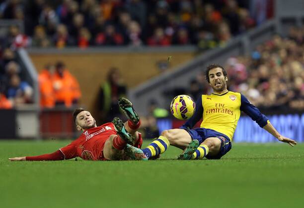Liverpool s Adam Lallana tussles with Arsenal s Mathieu Flamini Barclays Premier League - Liverpool vs Arsenal - Anfield - England - 21st December 2014 - Picture David Klein Sportimage EDITORIAL USE ONLY. No use with unauthorised audio, video, data, fixture lists, club league logos or live services. Online in-match use limited to 120 images, no video emulation. No use in betting, games or single club league player publications.