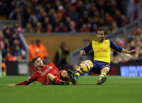 Liverpool s Adam Lallana tussles with Arsenal s Mathieu Flamini Barclays Premier League - Liverpool vs Arsenal - Anfield - England - 21st December 2014 - Picture David Klein Sportimage EDITORIAL USE ONLY. No use with unauthorised audio, video, data, fixture lists, club league logos or live services. Online in-match use limited to 120 images, no video emulation. No use in betting, games or single club league player publications.