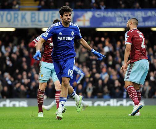 Diego Costa of Chelsea celebrates scoring his goal to make it 2-0 - Barclays Premier League - Chelsea vs West Ham United - Stamford Bridge Stadium - London - England - 26th December 2014 - Pic Robin Parker Sportimage EDITORIAL USE ONLY. No use with unauthorised audio, video, data, fixture lists, club league logos or live services. Online in-match use limited to 120 images, no video emulation. No use in betting, games or single club league player publications. DSC_3045