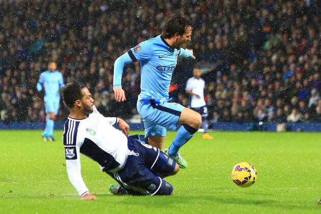 West Brom s Joleon Loscott fouls David Silva of Manchester City giving away a penalty - West Bromwich Albion vs. Manchester City - Barclay s Premier League - The Hawthorns - Birmingham - 26 12 2014 Pic Philip Oldham Sportimage EDITORIAL USE ONLY. No use with unauthorised audio, video, data, fixture lists, club league logos or live services. Online in-match use limited to 120 images, no video emulation. No use in betting, games or single club league player publications.