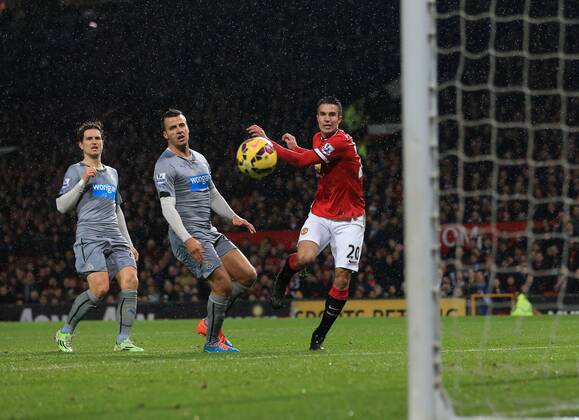 Manchester United ManU s Robin Van Persie scoring his sides third goal Barclays Premier League - Manchester United vs Newcastle United - Old Trafford - England - 26th December 2014 - Picture David Klein Sportimage EDITORIAL USE ONLY. No use with unauthorised audio, video, data, fixture lists, club league logos or live services. Online in-match use limited to 120 images, no video emulation. No use in betting, games or single club league player publications.