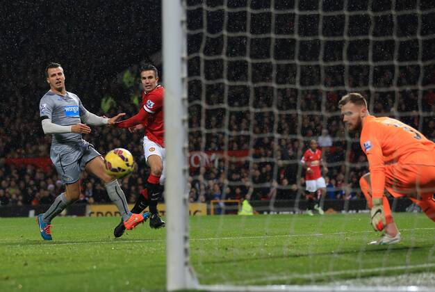 Manchester United ManU s Robin Van Persie scoring his sides third goal Barclays Premier League - Manchester United vs Newcastle United - Old Trafford - England - 26th December 2014 - Picture David Klein Sportimage EDITORIAL USE ONLY. No use with unauthorised audio, video, data, fixture lists, club league logos or live services. Online in-match use limited to 120 images, no video emulation. No use in betting, games or single club league player publications.
