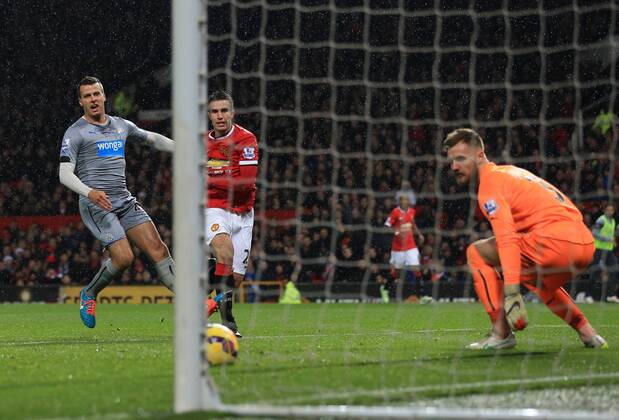 Manchester United ManU s Robin Van Persie scoring his sides third goal Barclays Premier League - Manchester United vs Newcastle United - Old Trafford - England - 26th December 2014 - Picture David Klein Sportimage EDITORIAL USE ONLY. No use with unauthorised audio, video, data, fixture lists, club league logos or live services. Online in-match use limited to 120 images, no video emulation. No use in betting, games or single club league player publications.