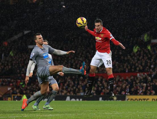 Manchester United ManU s Robin Van Persie scoring his sides third goal Barclays Premier League - Manchester United vs Newcastle United - Old Trafford - England - 26th December 2014 - Picture David Klein Sportimage EDITORIAL USE ONLY. No use with unauthorised audio, video, data, fixture lists, club league logos or live services. Online in-match use limited to 120 images, no video emulation. No use in betting, games or single club league player publications.