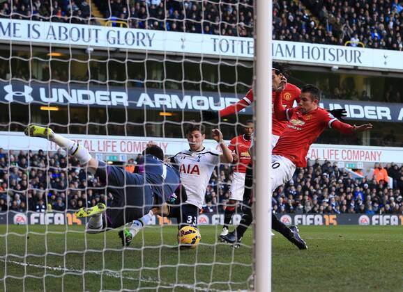 Tottenham s Hugo Lloris saves from Manchester United ManU s Robin Van Persie Barclays Premier League - Tottenham Hotspur vs Manchester United - White Hart Lane - England - 28th December 2014 - Picture David Klein Sportimage EDITORIAL USE ONLY. No use with unauthorised audio, video, data, fixture lists, club league logos or live services. Online in-match use limited to 120 images, no video emulation. No use in betting, games or single club league player publications.