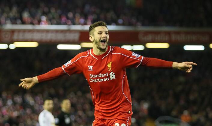 Adam Lallana of FC Liverpool celebrates after chasing down a back pass to score from the attempted clearance by Lucas Fabianski of Swansea City - Barclays Premier League - FC Liverpool vs Swansea City - Anfield Stadium - Liverpool - England - 29th December 2014 - EDITORIAL USE ONLY. No use with unauthorised audio, video, data, fixture lists, club league logos or live services. Online in-match use limited to 120 images, no video emulation. No use in betting, games or single club league player publications.