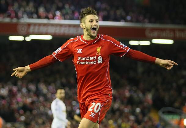 Adam Lallana of FC Liverpool celebrates after chasing down a back pass to score from the attempted clearance by Lucas Fabianski of Swansea City - Barclays Premier League - FC Liverpool vs Swansea City - Anfield Stadium - Liverpool - England - 29th December 2014 - EDITORIAL USE ONLY. No use with unauthorised audio, video, data, fixture lists, club league logos or live services. Online in-match use limited to 120 images, no video emulation. No use in betting, games or single club league player publications.