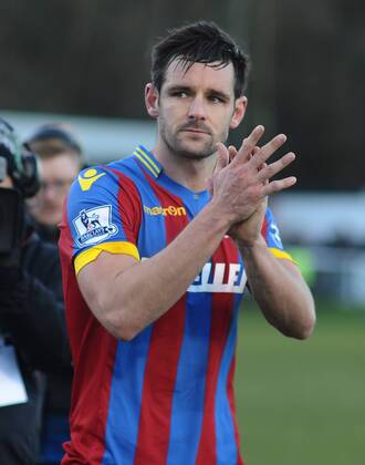 Football - 2014 2015 FA Cup - Third Round: Dover Athletic vs. Crystal Palace Palace s two goal scorer, Scott Dann salutes the fans after the game at the Crabble Athletic Ground. COLORSPORT ANDREW COWIE
