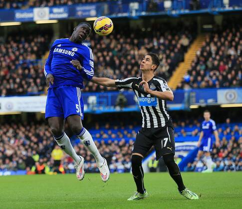 Chelsea s Kurt Zouma tussles with Newcastle s Ayoze Perez Premier League - Chelsea vs Newcastle United - Stamford Bridge - England - 10th January 2015 - Picture David Klein Sportimage EDITORIAL USE ONLY. No use with unauthorised audio, video, data, fixture lists, club league logos or live services. Online in-match use limited to 120 images, no video emulation. No use in betting, games or single club league player publications.