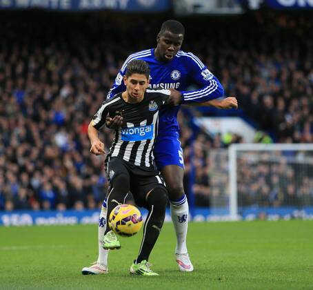 Chelsea s Kurt Zouma tussles with Newcastle s Ayoze Perez Premier League - Chelsea vs Newcastle United - Stamford Bridge - England - 10th January 2015 - Picture David Klein Sportimage EDITORIAL USE ONLY. No use with unauthorised audio, video, data, fixture lists, club league logos or live services. Online in-match use limited to 120 images, no video emulation. No use in betting, games or single club league player publications.
