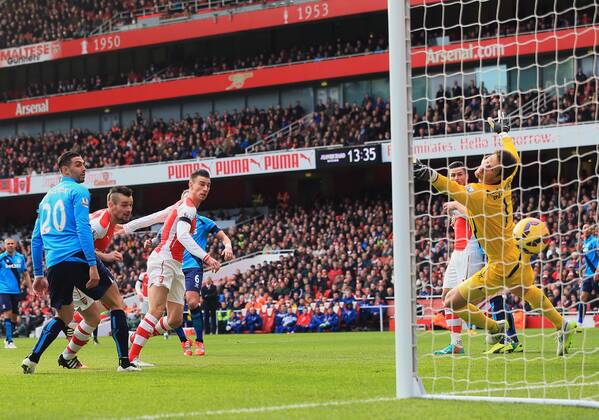 Arsenal s Laurent Koscielny scoring his sides opening goal Premier League - Arsenal vs Stoke City - Emirates Stadium - England - 11th January 2015 - Picture David Klein Sportimage EDITORIAL USE ONLY. No use with unauthorised audio, video, data, fixture lists, club league logos or live services. Online in-match use limited to 120 images, no video emulation. No use in betting, games or single club league player publications.