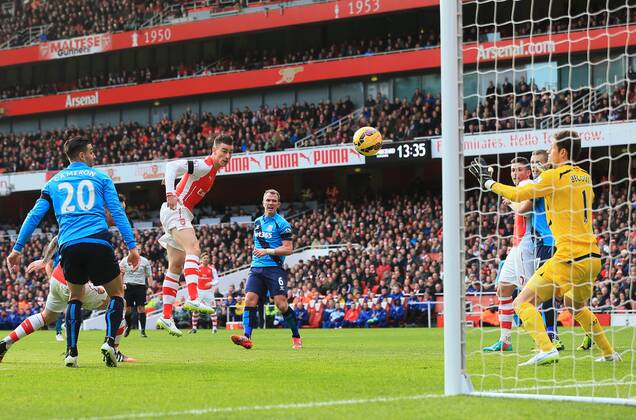 Arsenal s Laurent Koscielny scoring his sides opening goal Premier League - Arsenal vs Stoke City - Emirates Stadium - England - 11th January 2015 - Picture David Klein Sportimage EDITORIAL USE ONLY. No use with unauthorised audio, video, data, fixture lists, club league logos or live services. Online in-match use limited to 120 images, no video emulation. No use in betting, games or single club league player publications.