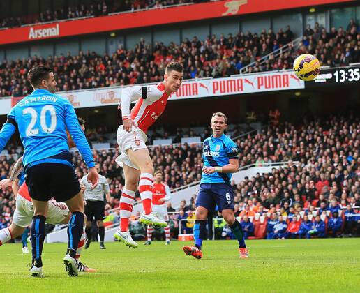Arsenal s Laurent Koscielny scoring his sides opening goal Premier League - Arsenal vs Stoke City - Emirates Stadium - England - 11th January 2015 - Picture David Klein Sportimage EDITORIAL USE ONLY. No use with unauthorised audio, video, data, fixture lists, club league logos or live services. Online in-match use limited to 120 images, no video emulation. No use in betting, games or single club league player publications.