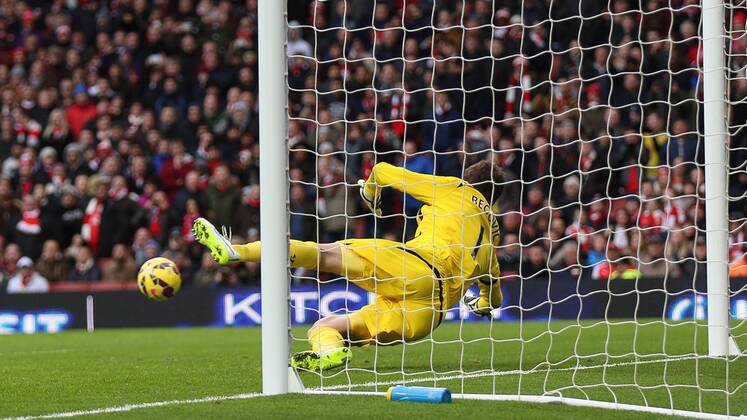 Football - 2014 2015 - Barclays Premier League, - Arsenal Vs Stoke City, Stoke City s Asmir Begovic dives to his right to stop Arsenal s AlexisSanchez shot at The Emirates Stadium ARS_STO