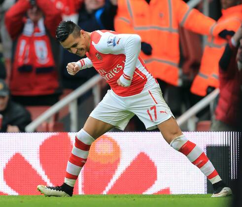Arsenal s Alexis Sanchez celebrates scoring his sides third goal Premier League - Arsenal vs Stoke City - Emirates Stadium - England - 11th January 2015 - Picture David Klein Sportimage EDITORIAL USE ONLY. No use with unauthorised audio, video, data, fixture lists, club league logos or live services. Online in-match use limited to 120 images, no video emulation. No use in betting, games or single club league player publications.