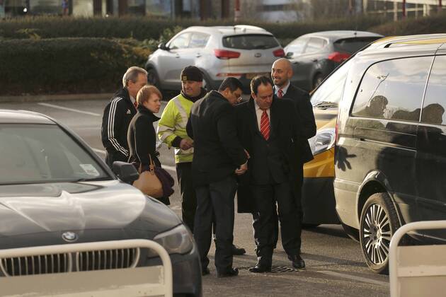Nottingham Forest chairman Fawaz Al Hasawi (front right) inspects damage to his car following the game, during which all four tyres were slashed - Football - Sky Bet Championship - Derby County vs Nottingham Forest - I-Pro Stadium Derby - Season 2014 2015 - 17th January 2015 - EDITORIAL USE ONLY. No use with unauthorised audio, video, data, fixture lists, club league logos or live services. Online in-match use limited to 120 images, no video emulation. No use in betting, games or single club league player publications.