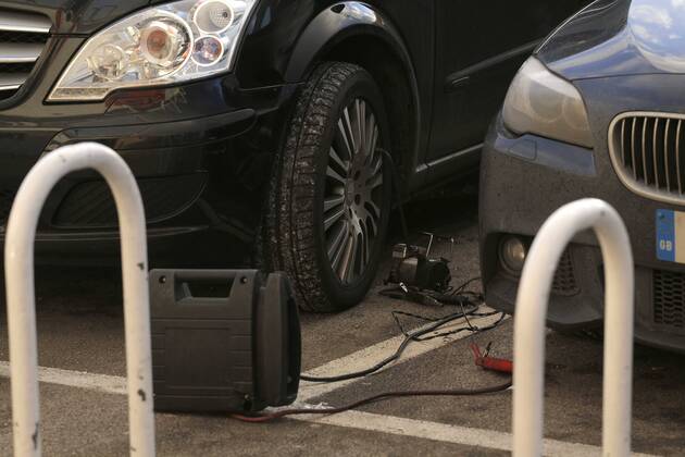 Repairs to the vehicle of Nottingham Forest chairman Fawaz Al Hasawi when all four tyres were slashed during the game - Football - Sky Bet Championship - Derby County vs Nottingham Forest - I-Pro Stadium Derby - Season 2014 2015 - 17th January 2015 - EDITORIAL USE ONLY. No use with unauthorised audio, video, data, fixture lists, club league logos or live services. Online in-match use limited to 120 images, no video emulation. No use in betting, games or single club league player publications.