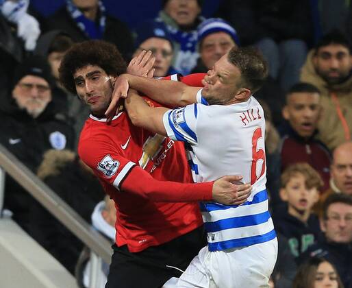 QPR s Clint Hill tussles with Manchester United ManU s Marouane Fellaini Barclays Premier League - Queens Park Rangers vs Manchester United - Loftus Road - England - 17th January 2015 - Picture David Klein Sportimage EDITORIAL USE ONLY. No use with unauthorised audio, video, data, fixture lists, club league logos or live services. Online in-match use limited to 120 images, no video emulation. No use in betting, games or single club league player publications.