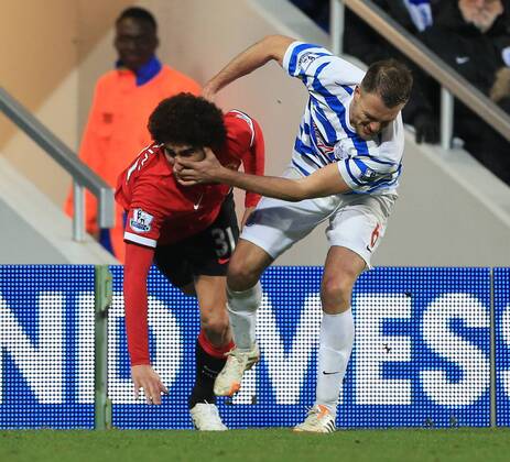 QPR s Clint Hill tussles with Manchester United ManU s Marouane Fellaini Barclays Premier League - Queens Park Rangers vs Manchester United - Loftus Road - England - 17th January 2015 - Picture David Klein Sportimage EDITORIAL USE ONLY. No use with unauthorised audio, video, data, fixture lists, club league logos or live services. Online in-match use limited to 120 images, no video emulation. No use in betting, games or single club league player publications.