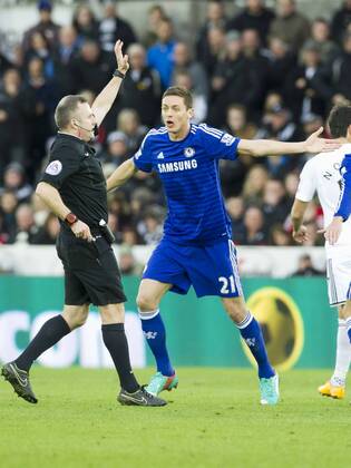 Football - 2014 2015 Premier League - Swansea City vs. Chelsea Nemanja Matic of Chelsea protests to referee Moss at The Liberty Stadium. COLORSPORT WINSTON BYNORTH
