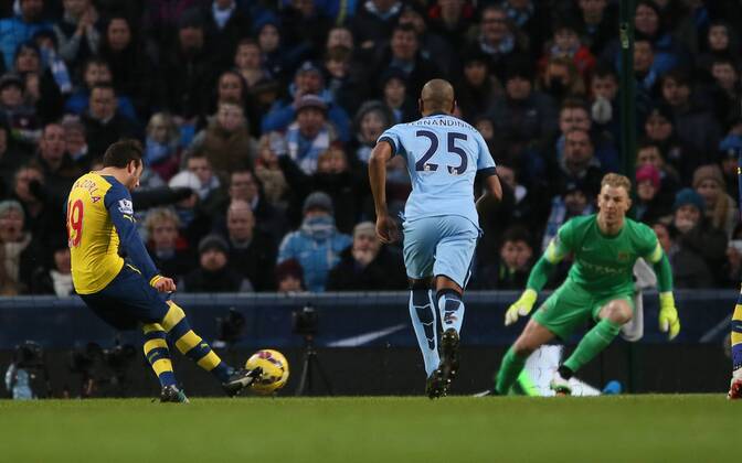 Santi Cazorla of Arsenal scores from the penalty spot past Joe Hart of Manchester City to go 0-1 up - Barclays Premier League - Manchester City vs Arsenal - Etihad Stadium - Manchester - England - 18th January 2015 - Picture Simon Bellis Sportimage EDITORIAL USE ONLY. No use with unauthorised audio, video, data, fixture lists, club league logos or live services. Online in-match use limited to 120 images, no video emulation. No use in betting, games or single club league player publications.
