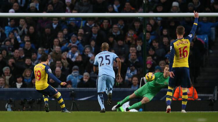 Santi Cazorla of Arsenal scores from the penalty spot past Joe Hart of Manchester City to go 0-1 up - Barclays Premier League - Manchester City vs Arsenal - Etihad Stadium - Manchester - England - 18th January 2015 - Picture Simon Bellis Sportimage EDITORIAL USE ONLY. No use with unauthorised audio, video, data, fixture lists, club league logos or live services. Online in-match use limited to 120 images, no video emulation. No use in betting, games or single club league player publications.