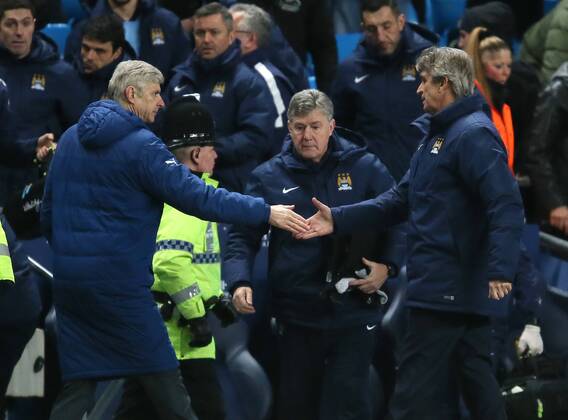 Arsene Wenger manager of Arsenal shakes hands with Manuel Pellegrini manager of Manchester City at the end of the match - Barclays Premier League - Manchester City vs Arsenal - Etihad Stadium - Manchester - England - 18th January 2015 - Picture Simon Bellis Sportimage EDITORIAL USE ONLY. No use with unauthorised audio, video, data, fixture lists, club league logos or live services. Online in-match use limited to 120 images, no video emulation. No use in betting, games or single club league player publications.