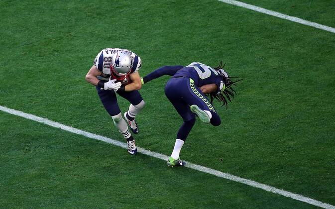 01 February 2015: New England Patriots wide receiver Danny Amendola 80 is hit by Seattle Seahawks cornerback Richard Sherman 25 during the first half of Super Bowl XLIX between the Seattle Seahawks and the New England Patriots at University of Phoenix Stadium in Glendale, Az. NFL American Football Herren USA FEB 01 Super Bowl XLIX - Patriots v Seahawks Icon3171502010831 EDITORIAL USE ONLY