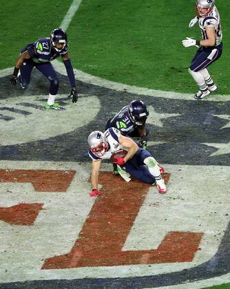 01 February 2015: New England Patriots wide receiver Julian Edelman 11 is tripped up by Seattle Seahawks strong safety Kam Chancellor 31 during the second half of Super Bowl XLIX between the Seattle Seahawks and the New England Patriots at University of Phoenix Stadium in Glendale, Az. The New England Patriots beat the Seattle Seahawks 28-24. NFL American Football Herren USA FEB 01 Super Bowl XLIX - Patriots v Seahawks Icon3171502012677 EDITORIAL USE ONLY