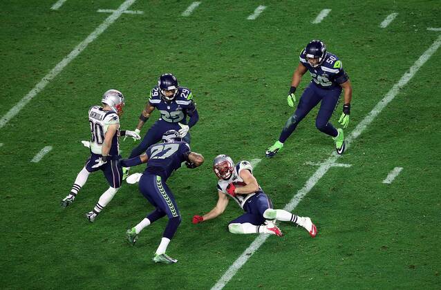 01 February 2015: New England Patriots wide receiver Julian Edelman 11 is tackled by Seattle Seahawks cornerback Tharold Simon 27 during the second half of Super Bowl XLIX between the Seattle Seahawks and the New England Patriots at University of Phoenix Stadium in Glendale, Az. The New England Patriots beat the Seattle Seahawks 28-24. NFL American Football Herren USA FEB 01 Super Bowl XLIX - Patriots v Seahawks Icon3171502012689 EDITORIAL USE ONLY