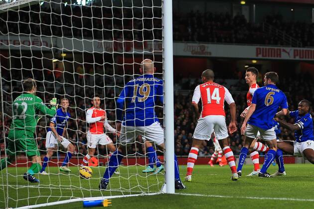 Arsenal s Laurent Koscielny scoring his sides opening goal Barclays Premier League- Arsenal vs Leicester City - Emirates Stadium - England - 10th February 2015 - Picture David Klein Sportimage EDITORIAL USE ONLY. No use with unauthorised audio, video, data, fixture lists, club league logos or live services. Online in-match use limited to 120 images, no video emulation. No use in betting, games or single club league player publications.