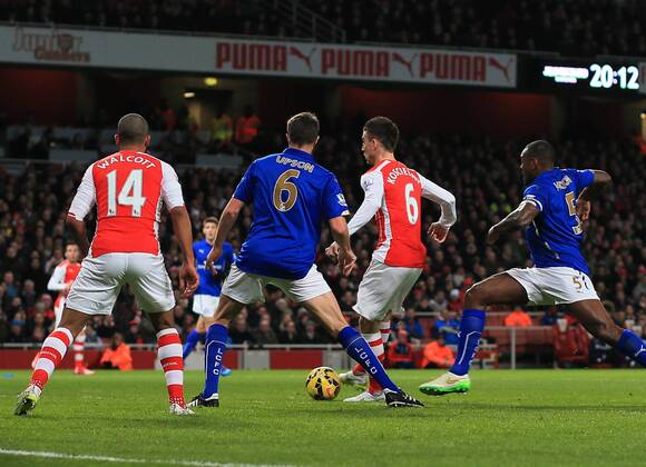 Arsenal s Laurent Koscielny scoring his sides opening goal Barclays Premier League- Arsenal vs Leicester City - Emirates Stadium - England - 10th February 2015 - Picture David Klein Sportimage EDITORIAL USE ONLY. No use with unauthorised audio, video, data, fixture lists, club league logos or live services. Online in-match use limited to 120 images, no video emulation. No use in betting, games or single club league player publications.