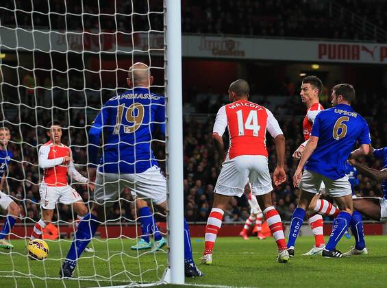 Arsenal s Laurent Koscielny scoring his sides opening goal Barclays Premier League- Arsenal vs Leicester City - Emirates Stadium - England - 10th February 2015 - Picture David Klein Sportimage EDITORIAL USE ONLY. No use with unauthorised audio, video, data, fixture lists, club league logos or live services. Online in-match use limited to 120 images, no video emulation. No use in betting, games or single club league player publications.