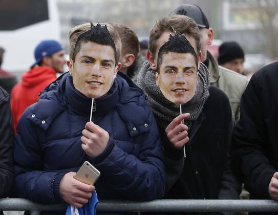 Real Madrid players arrive in Gelsenkirchen to play the Champions League match. In this picture, fans with masks of Cristiano Ronaldo. xPABLOGARCIAx 