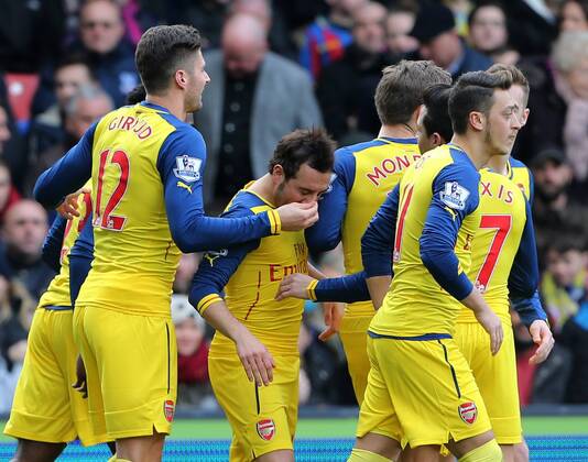 Arsenal s Santi Cazorla celebrates scoring his sides opening goal as Olivier Giroud holds his nose Barclays Premier League - Crystal Palace vs Arsenal - Selhurst Park - England - 21st February 2015 - Picture David Klein Sportimage EDITORIAL USE ONLY. No use with unauthorised audio, video, data, fixture lists, club league logos or live services. Online in-match use limited to 120 images, no video emulation. No use in betting, games or single club league player publications.