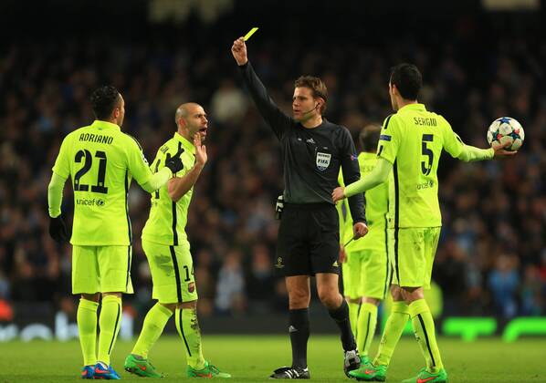 Adriano of Barcelona is shown a yellow card - Manchester City vs. Barcelona - UEFA Champions League - Etihad Stadium - Manchester - EDITORIAL USE ONLY. No use with unauthorised audio, video, data, fixture lists, club league logos or live services. Online in-match use limited to 120 images, no video emulation. No use in betting, games or single club league player publications.