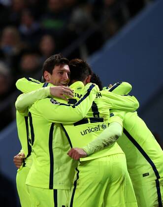 Players of Barcelona celebrate their teammate Luis Suarez s second goal during the UEFA Champions league Round of 16 first leg match between Manchester City and Barcelona at Etihad Stadium in Manchester, Britain, on Feb. 24, 2015. Barcelona won 2-1. ) (SP)BRITAIN-MANCHESTER-FOOTBALL-CHAMPIONS LEAGUE-ROUND OF 16 1ST LEG-MANCHESTER CITY VS BARCELONA HanxYan 