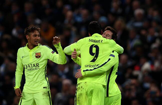 Neymar (L) and Lionel Messi (R) of Barcelona celebrate their teammate Luis Suarez s second goal during the UEFA Champions league Round of 16 first leg match between Manchester City and Barcelona at Etihad Stadium in Manchester, Britain, on Feb. 24, 2015. Barcelona won 2-1. ) (SP)BRITAIN-MANCHESTER-FOOTBALL-CHAMPIONS LEAGUE-ROUND OF 16 1ST LEG-MANCHESTER CITY VS BARCELONA HanxYan 