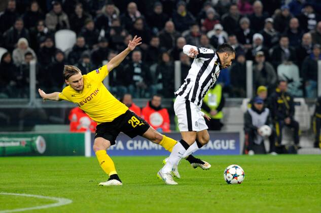 24.02.2015. Turin, Italy. Champions League Football. Juventus versus Borussia Dortmund. Marcel Schmelzer of Borussia and Carlos Tevez of Juventus battle for the ball. xPierpaoloxPiciuccox  ActionPlus11600316