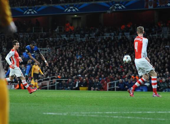 Football - 2014 2015 Champions League - Round of 16, First Leg: Arsenal vs. AS Monaco Geoffrey Kondogbia of Monaco scores his goal from a massive deflection off of Per Mertesacker at The Emirates. COLORSPORT ANDREW COWIE