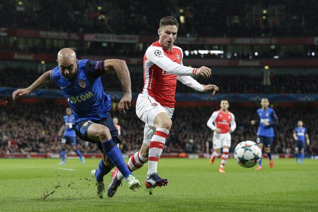 25.02.2015. London, England. Champions League Football. Arsenal versus AS Monaco. AS Monaco& x2019;s Aymen Abdennour makes a clearance under pressure from Arsenal& x2019;s Olivier Giroud xCraigxMercerx  ActionPlus11600459