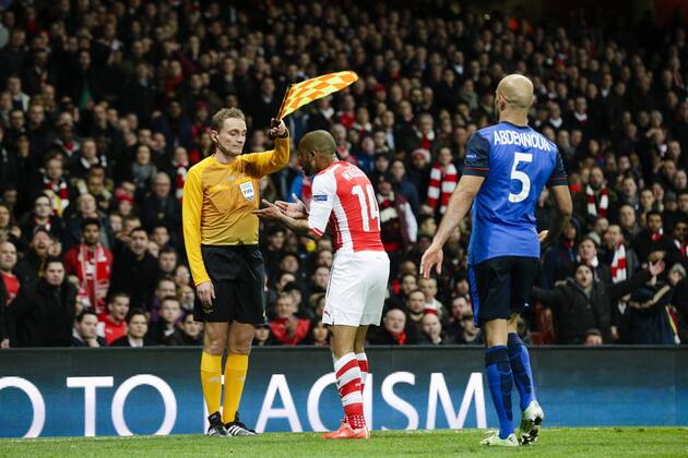 25.02.2015. London, England. Champions League Football. Arsenal versus AS Monaco. Arsenal& x2019;s Theo Walcott argues with the assistant referee over a decision xCraigxMercerx  ActionPlus11600465