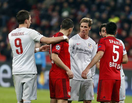 First leg of 1 8 Champions League between Bayer Leverkusen and Atletico Madrid Madrid. In this picture, Mario Mandzukic, Kyriakos Papadopoulos, Emir Spahic and Fernando Torres. xBEATRIZxGUZMANx 